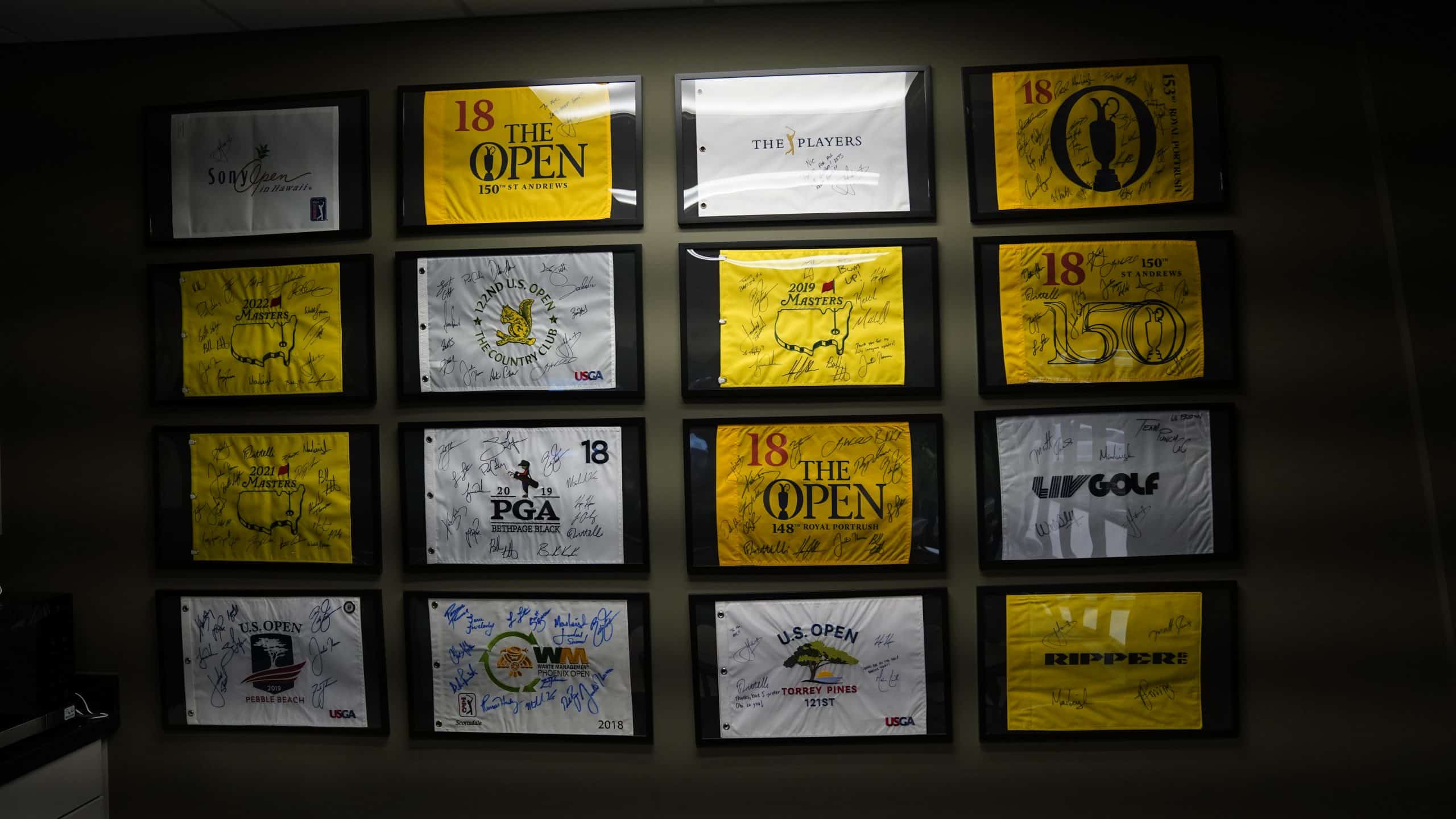 Signed tournament flags on the wall of the Audens studio